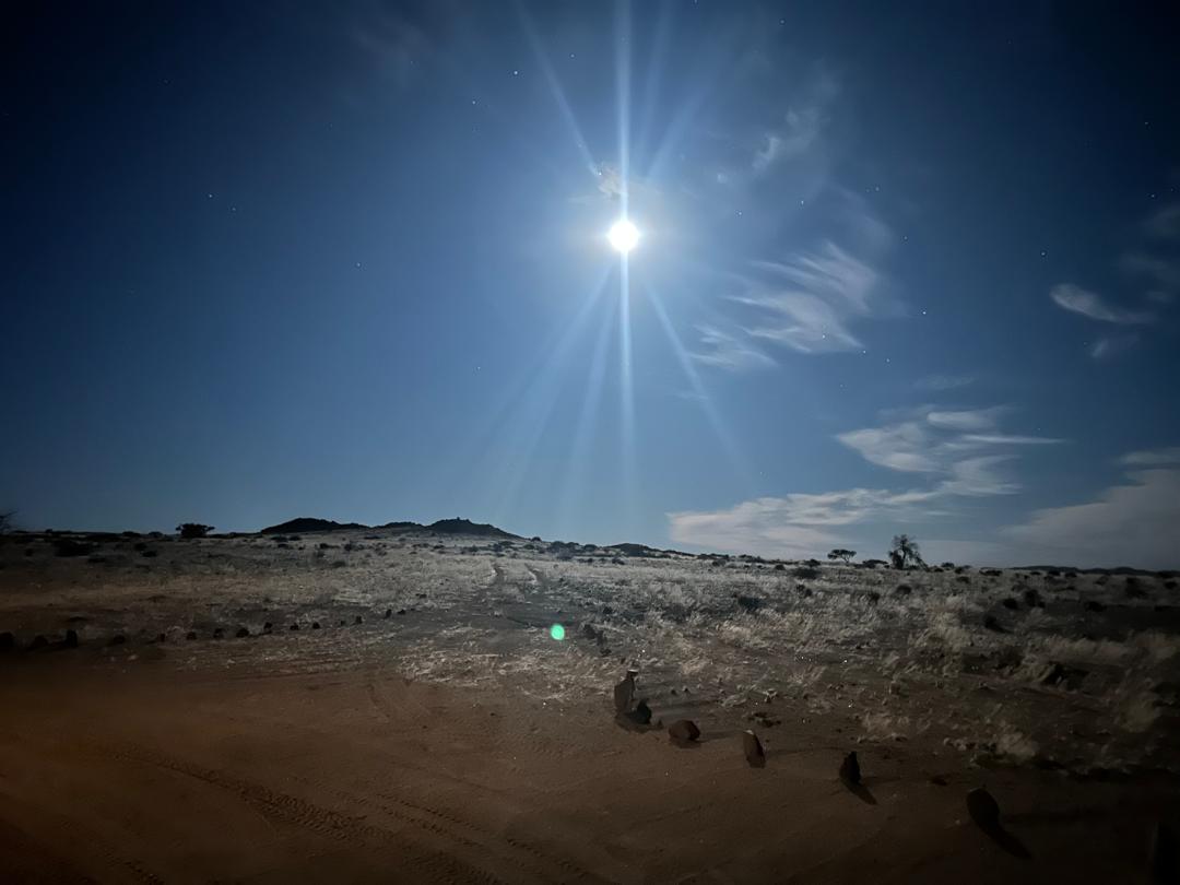 Night operations under a full moon in the Namibian desert